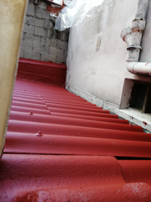 Impermeabilización de cubierta con placas de fibrocemento en C/Noya, A Coruña
